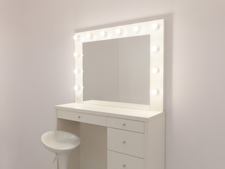Makeup mirror with gold lights. Photo of the mirror in the make-up room. Backstage dressing room