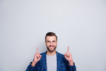 Portrait of his he nice attractive cheerful cheery glad bearded guy in checked blazer pointing up...