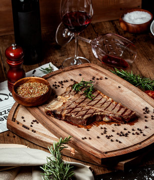 beef stek piece garnished with dried herbs and black pepper