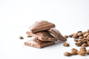 pieces of chocolate with nuts isolated on white