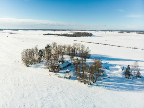 Beautiful aerial view of snow covered fields. Scenic winter landscape near Vilnius, Lithuania.
