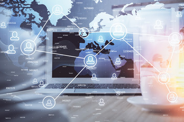 Computer on desktop with social network theme icon. Multi exposure. Concept of international connections.