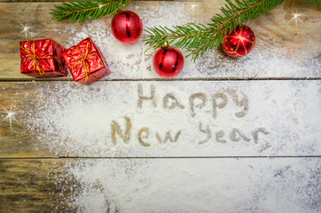 Christmas or New year background concept. Flour text and festive Christmas decoration on wooden background. Beautiful Christmas background. The view from the top