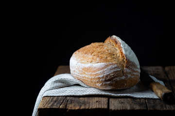 Fresh homemade crisp bread on wooden background. French bread. Bread at leaven. Unleavened bread