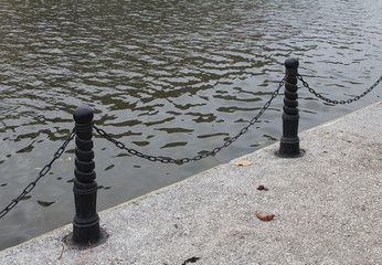 Fence on the embankment of the river.