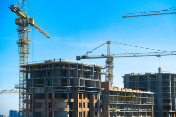 the high crane at a construction site