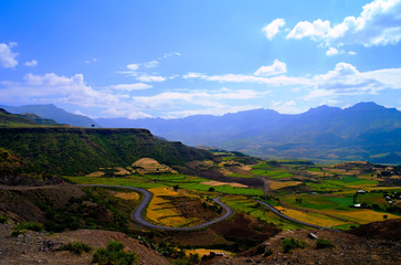Aerial Panorama of Semien mountains and valley with fields of teff around Lalibela,Ethiopia