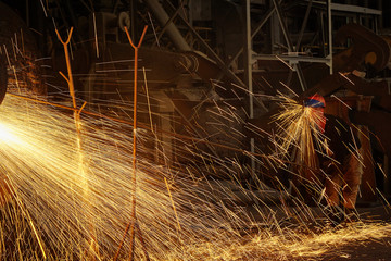 Metallurgist Steelmaker at ingot. Metallurgical production.