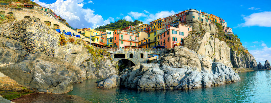 View of Manarola town on rocky coast at famous Cinque Terre National Park. Liguria, Italy