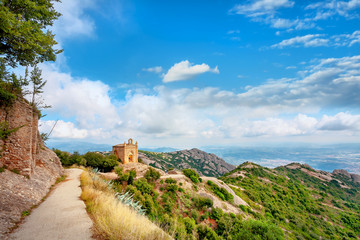 Fototapeta na wymiar Ruins of chapel Sant Joan in mountains at Montserrat monastery. Catalonia, Spain