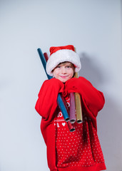 Charming boy wearing Santa's Hat in red sweater