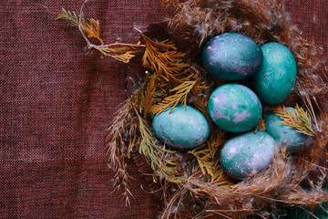 Space galactic Easter eggs in nest. Flatlay