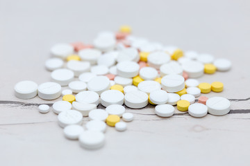 Colorful medical pills on the table, for your text