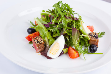 tuna salad and arugula with cherry tomatoes