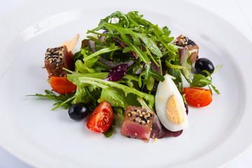 tuna salad and arugula with cherry tomatoes