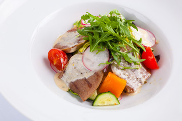 beef salad with greens and vegetables
