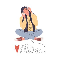 Young woman in headphones listening to music.