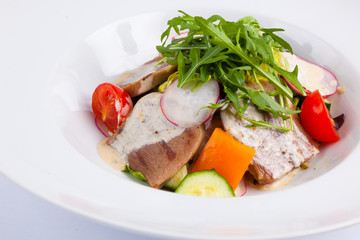 beef salad with greens and vegetables