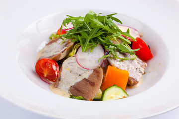 beef salad with greens and vegetables