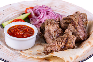 Pieces of beef meat with sauce