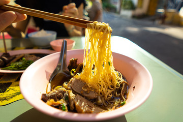 egg noodle and duck on bowl. thai street food