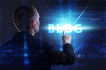 Business, Technology, Internet and network concept. Young businessman working on a virtual screen of the future and sees the inscription: Blog