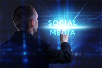 Business, Technology, Internet and network concept. Young businessman working on a virtual screen of the future and sees the inscription: Social media