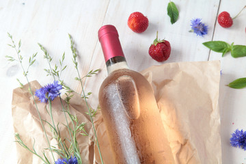 bottle of  rose wine and strawberries