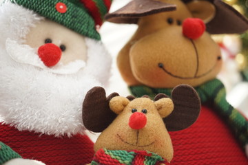 Friendly company of Santa Claus and his animal friends, smiling soft toys, New Year card.
