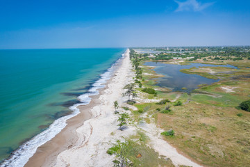 Fototapeta premium Aerial view of Atlantic coast near Palmarin. Saloum Delta National Park, Joal Fadiout, Senegal. Africa. Photo made by drone from above.