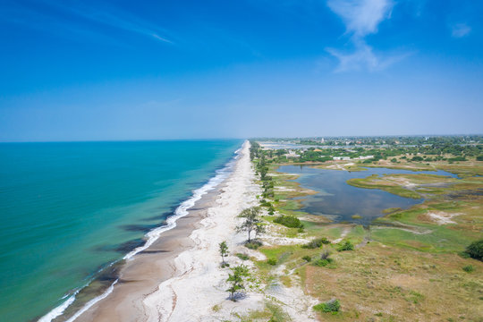 Aerial view of Atlantic coast near Palmarin. Saloum Delta National Park, Joal Fadiout, Senegal. Africa. Photo made by drone from above.
