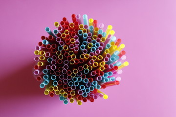 bright tubules for a cocktail on a pink background
