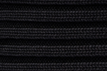 Striped of knitted black fabric texture background