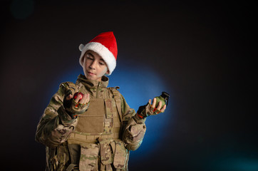 teen in soldier's uniform and Santa Claus hat