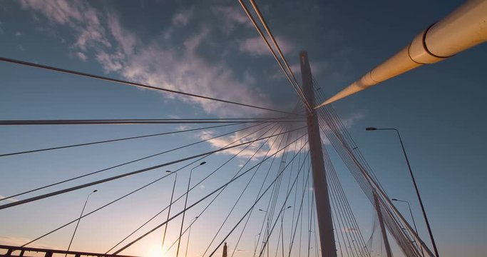 New stylish expressway Western Speed Diameter in St. Petersburg, the Big Cable-stayed Bridge in the rays of the warm evening sunset impresses with its size and beauty