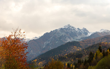 Panoramic  view snow-capped peaks of mountains with low clouds in Svaneti, in the mountainous part of Georgia