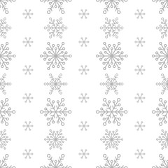 Winter seamless pattern with flat silver grey snowflakes on white background. New Year backdrop.
