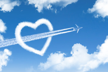 High flying passenger plane pierces the heart in the form of a cloud.