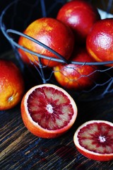 red Sicilian orange (bloody orange) on a dark background. copy space