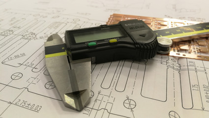 Engineering drawing and digital vernier calipers ,Measuring the dimensions of part with metal...