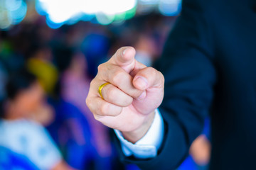 A suit man pointing finger