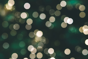 Background of Christmas light bokehs decorating on pine tree