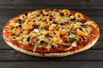 pizza with shrimp on a wooden table
