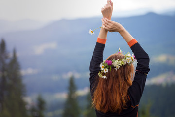 girl in a wreath of wildflowers