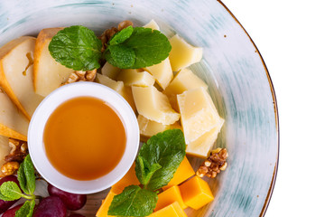 Cheese plate, served with honey and walnuts