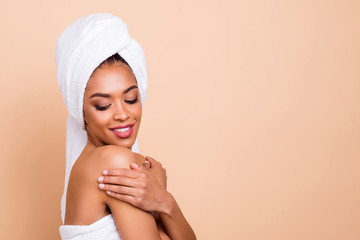 Close-up profile side view portrait of her she nice-looking attractive well-groomed cheerful dreamy lady caressing touching flawless smooth skin isolated over beige pastel background