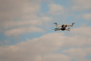 Quadcopter Drone with cloud and blue sky