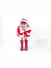 Asian girl is wearing a Santa costume to celebrate Christmas. White background