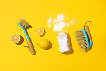 Flat lay composition with eco-friendly natural cleaners. Baking soda, salt, lemon, mustard powder...