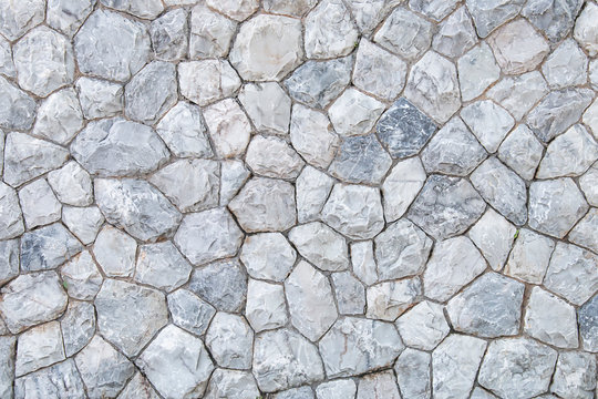 The wall background is made of natural granite.